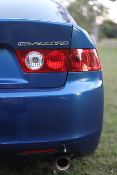 Blue audi car on the road during the day
